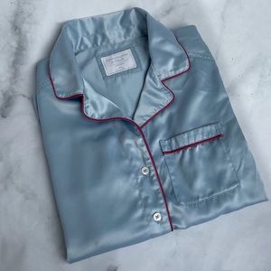 Gently used baby blue satin blouse. No tears